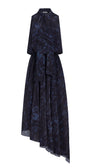 A sleeveless dark navy blue and black abstract patterned dress with a high collar, tie neckline, and asymmetrical draped skirt, shown on a plain white background.