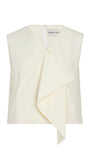 An off-white sleeveless top by Derek Lam, featuring a draped asymmetrical front overlay and a white zipper at the neckline, shown on a plain white background.