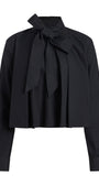 A black long-sleeve blouse with a high collar and a large bow tied at the front, shown on a plain white background.