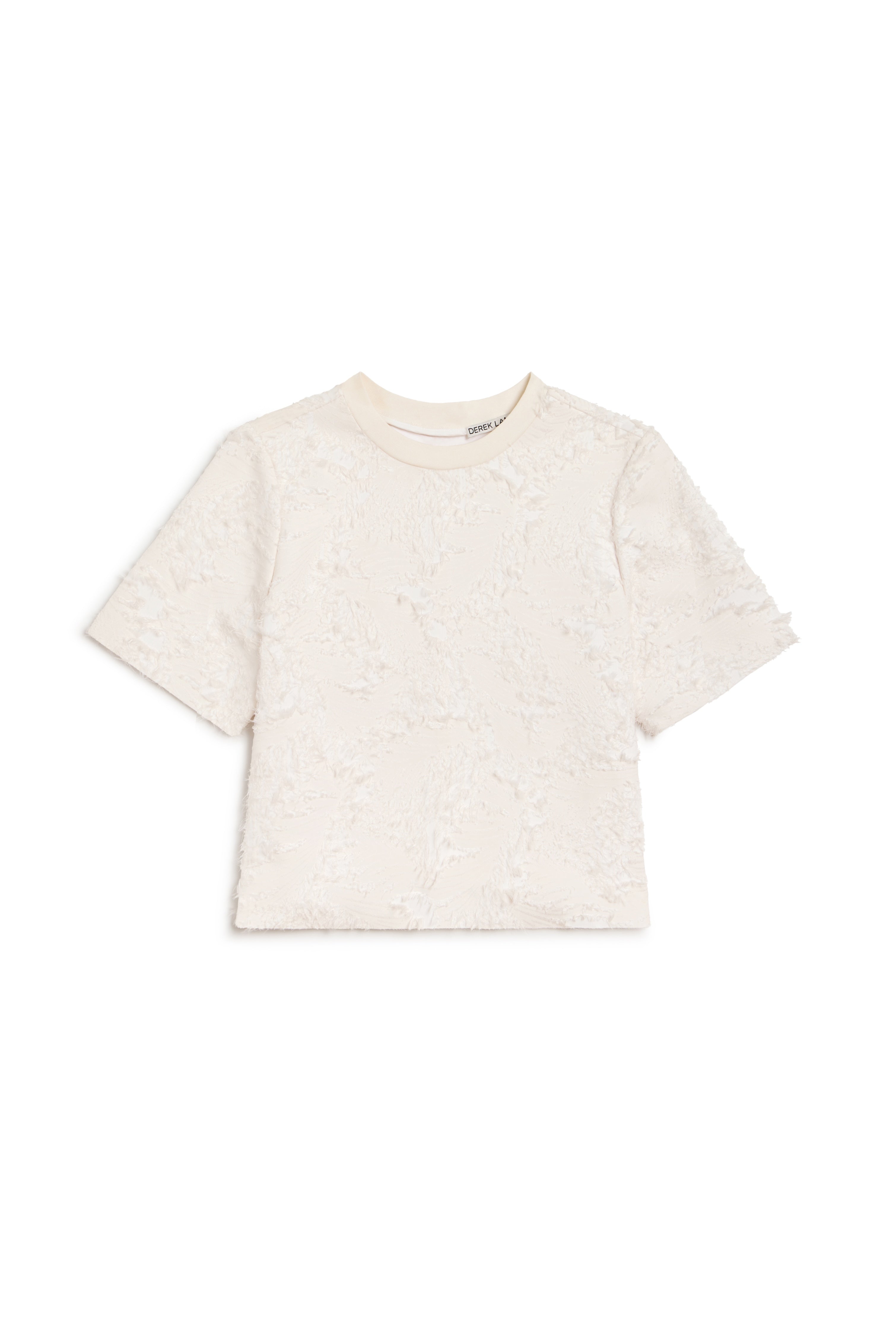 An off-white short-sleeve crop top with a textured, raised floral lace pattern, shown flat on a white background.