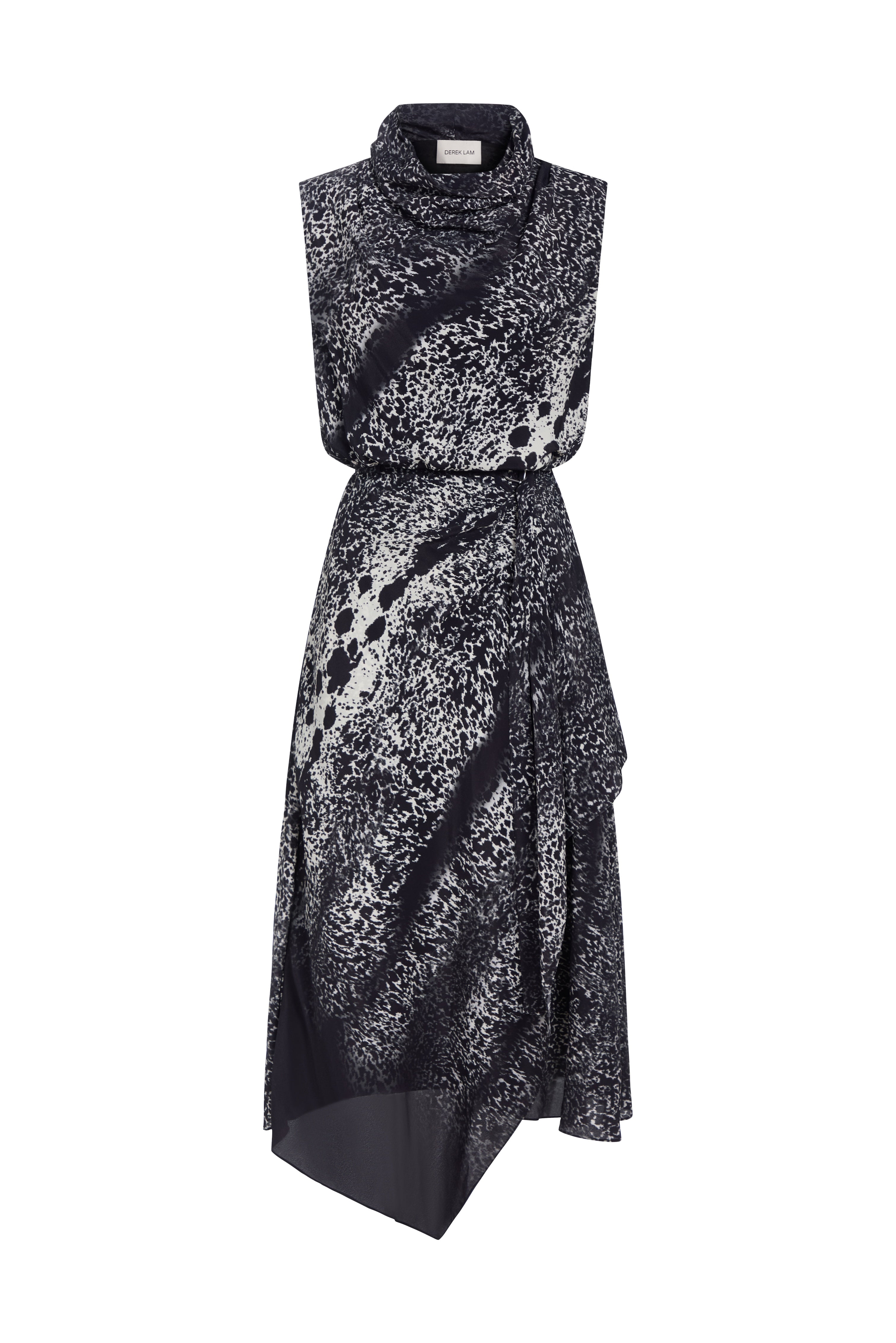 A sleeveless high-neck midi dress with an abstract black and white spotted pattern, featuring a wrap-style skirt and asymmetrical hemline, shown against a plain white background.