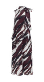 A sleeveless maxi dress with a high collar and side tie, featuring an abstract brushstroke pattern in burgundy, black, and white.