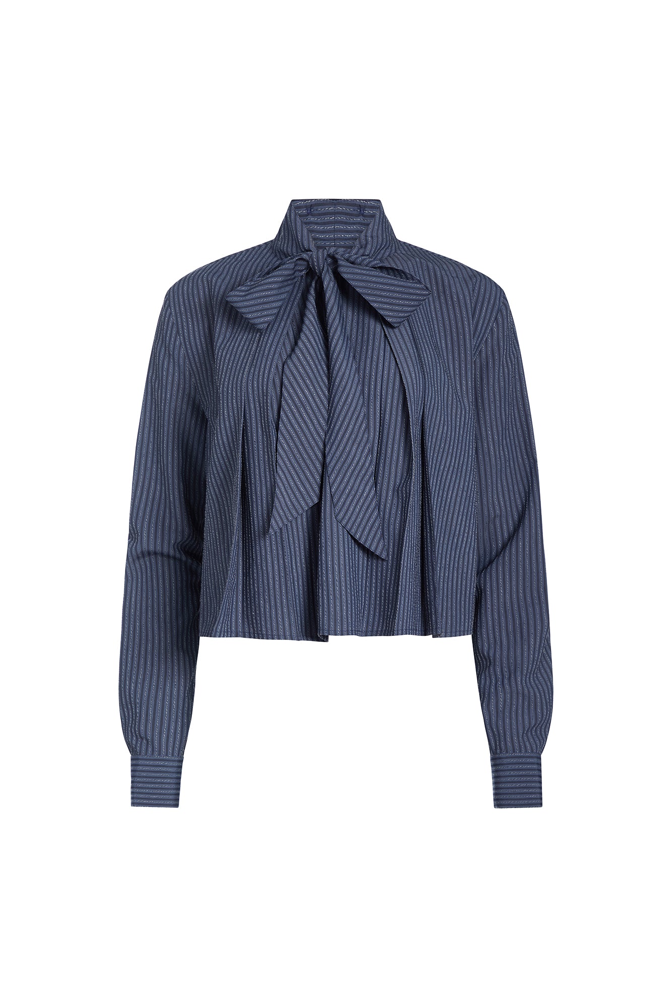 A cropped long-sleeve blouse with vertical navy and white stripes, featuring a large bow tie at the collar and a pleated front design, shown against a plain white background.
