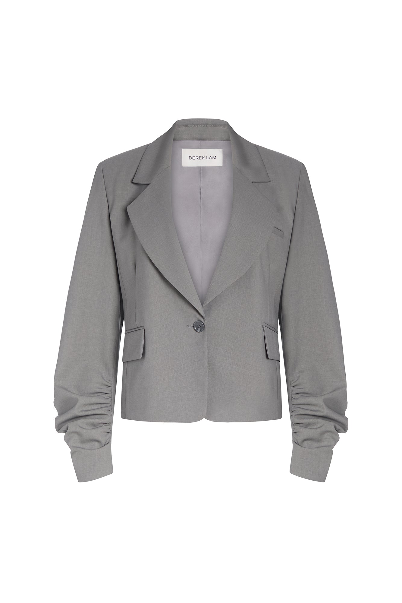 A gray cropped blazer with dramatic gathered sleeves, shown flat against a white background. 