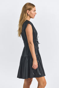 Woman wearing a black dress on a white background