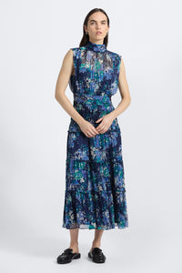 Woman wearing a blue floral dress on a white background
