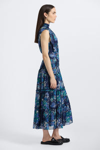 Woman wearing a blue floral dress on a white background